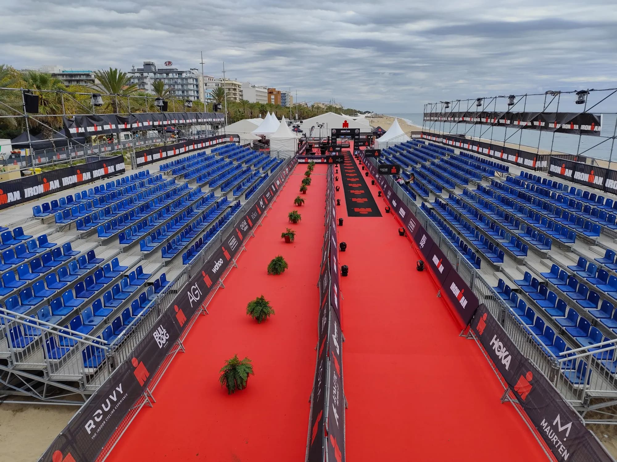 A transition area with a red carpet and bike racks